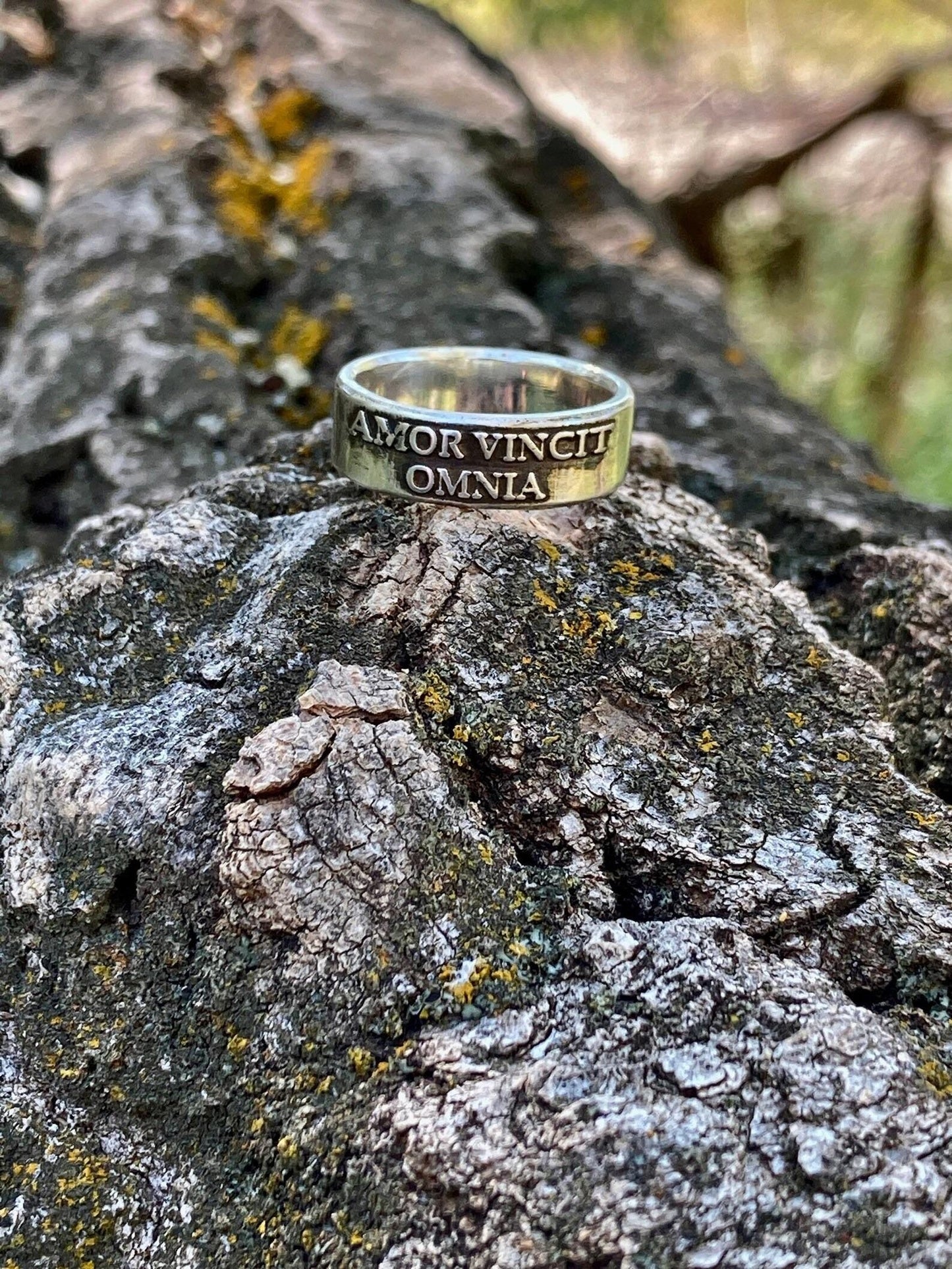 Amor Vincit Omnia wide sterling silver ring