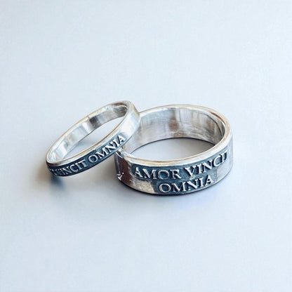 Matching thin and wide Amor Vincit Omnia rings