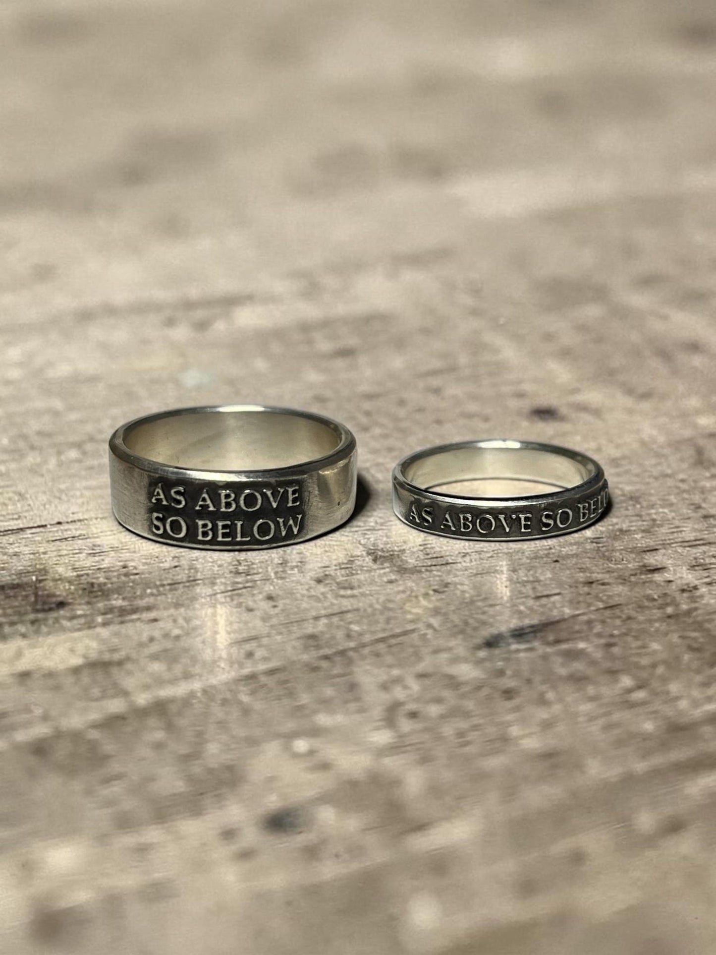 As Above So Below couples rings with raised lettering
