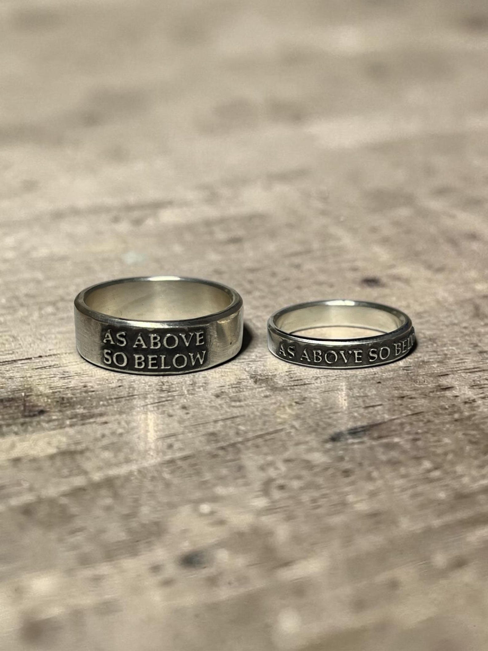 As Above So Below couples rings with raised lettering