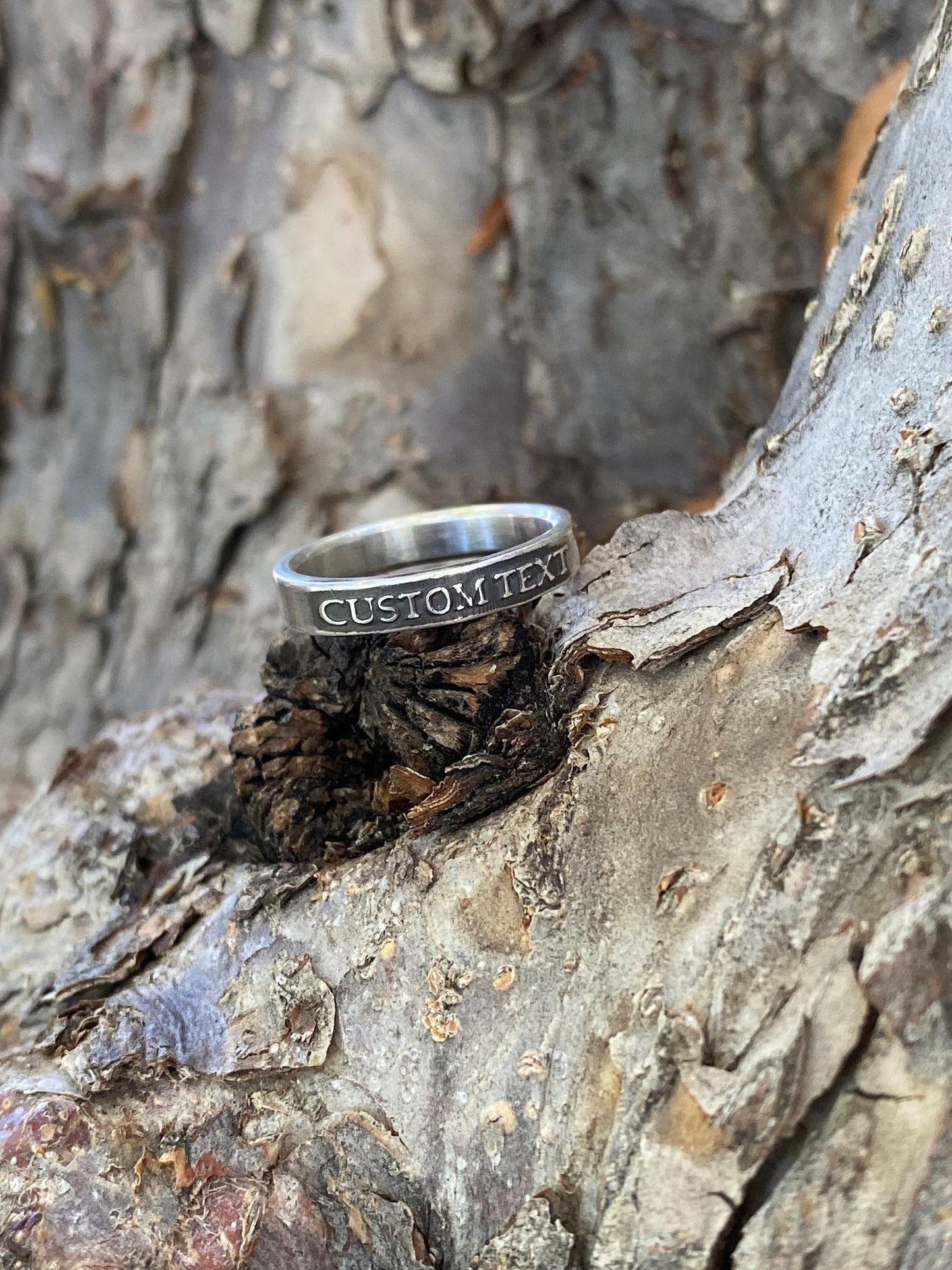 Thin personalized sterling silver ring with custom raised text