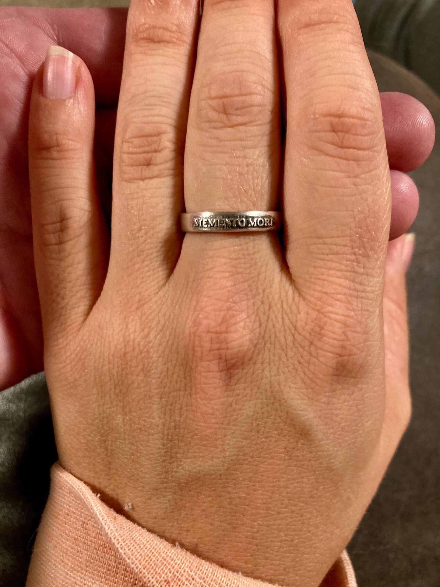 Memento Mori sterling silver band worn on hand