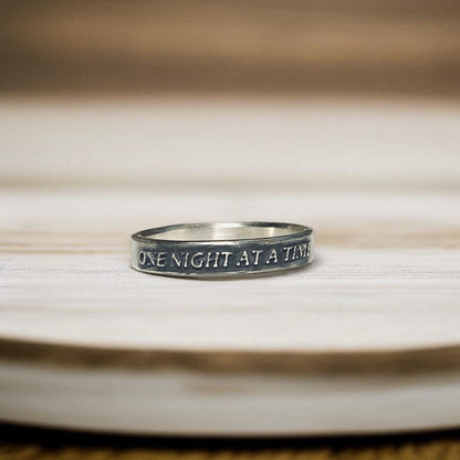 One Night at a Time thin sterling silver ring with raised lettering