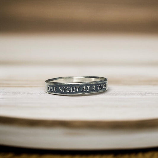 One Night at a Time thin sterling silver ring with raised lettering