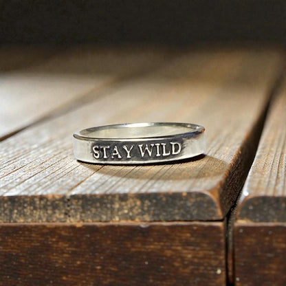 Stay Wild sterling silver ring with raised lettering