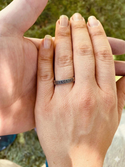 Till Death sterling silver ring worn on a finger